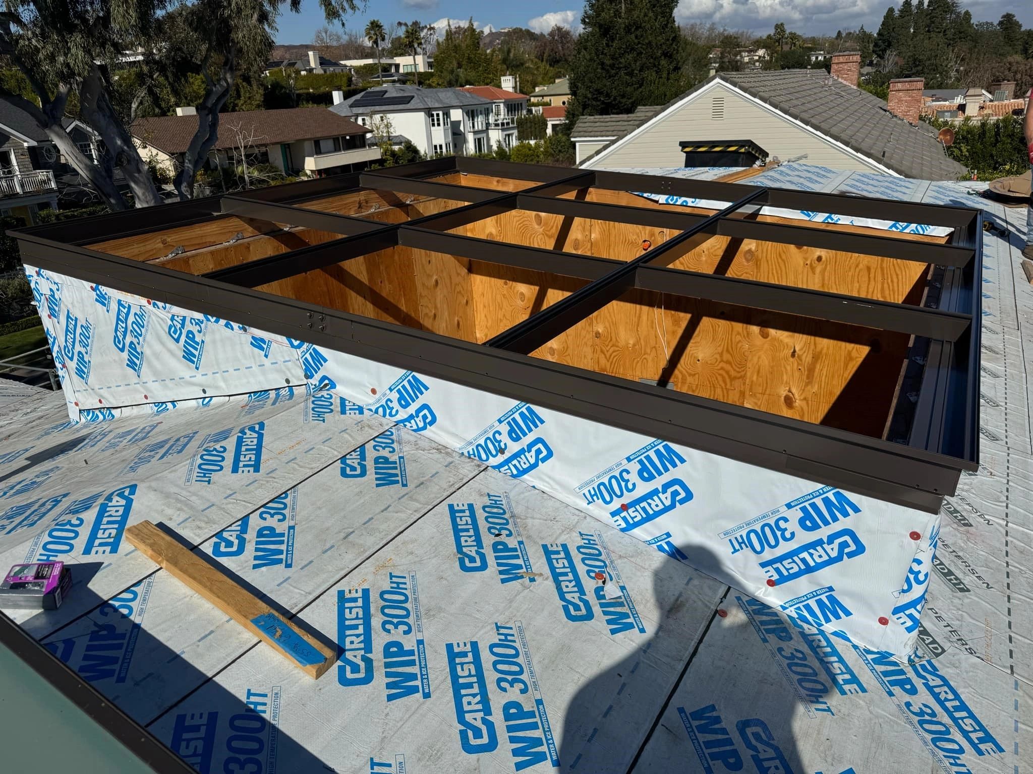 Skylight installation with Carlisle WIP 300+ waterproofing — before