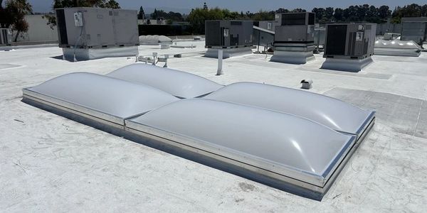 Commercial flat roof with dome skylights