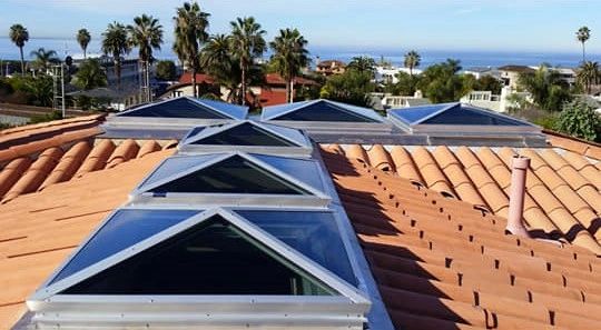 Skylights on residential terracotta tile roof