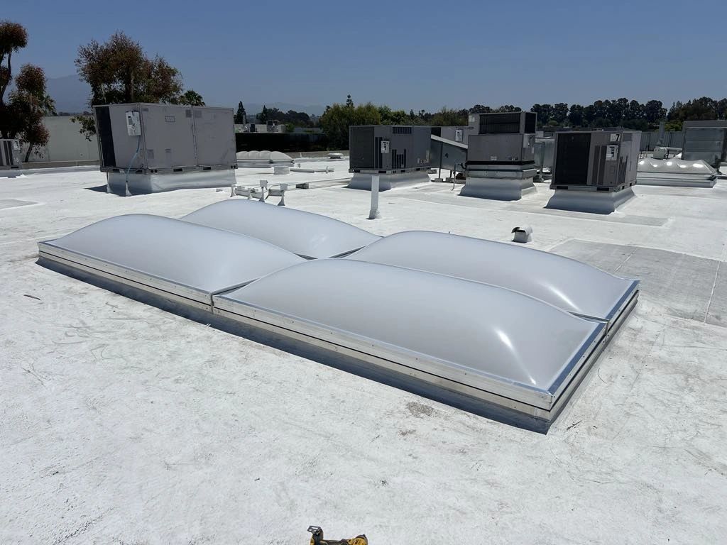 Commercial flat roof with dome skylights